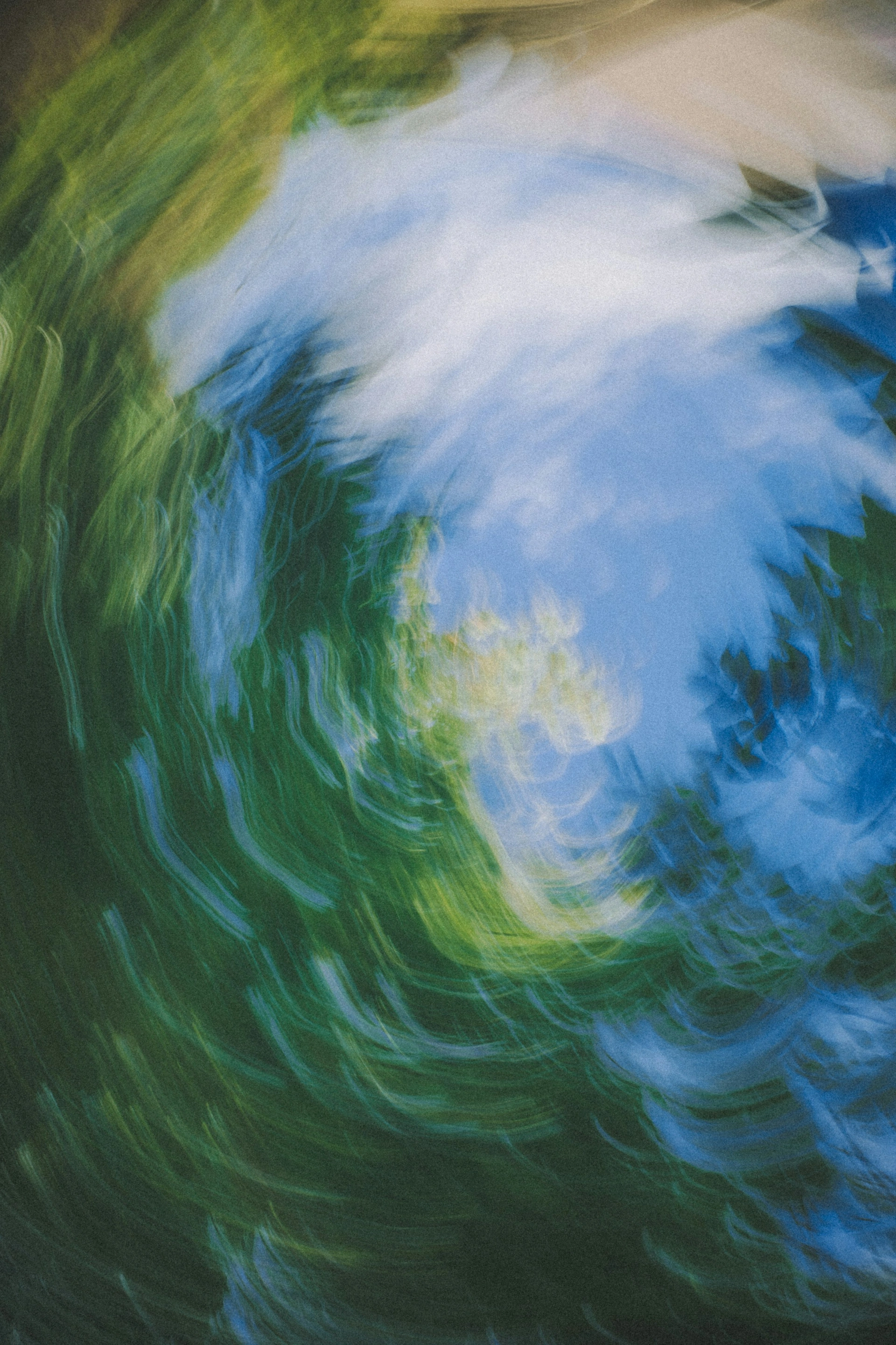 Aerial view of tropical river winding through dense rainforest canopy