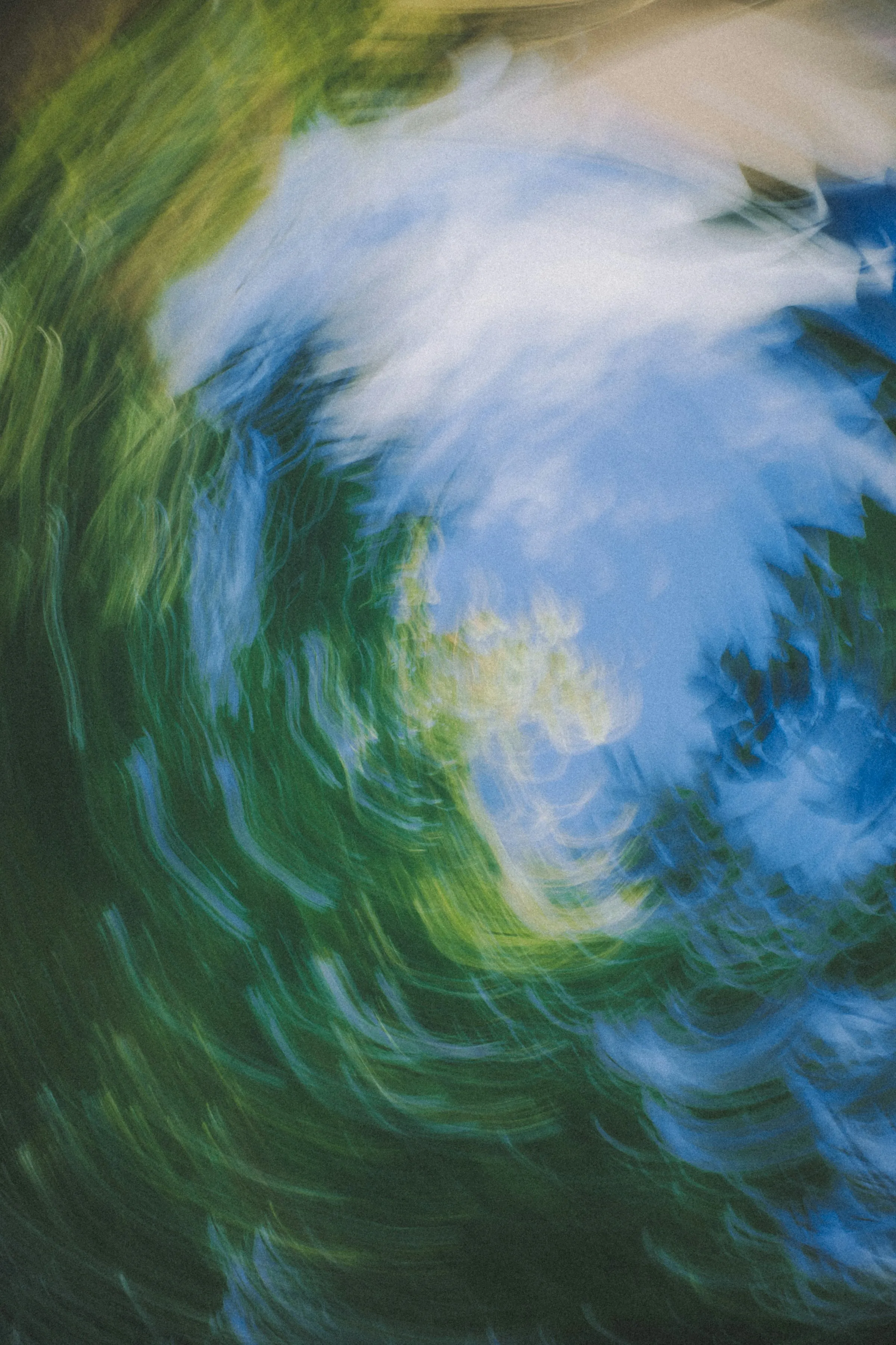 Aerial view of tropical river winding through dense rainforest canopy